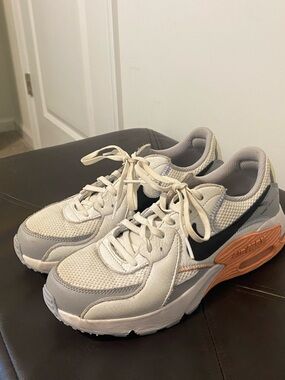Nike Women's Cream, Gray & Black Athletic Sneakers with Orange Midsole Accent
